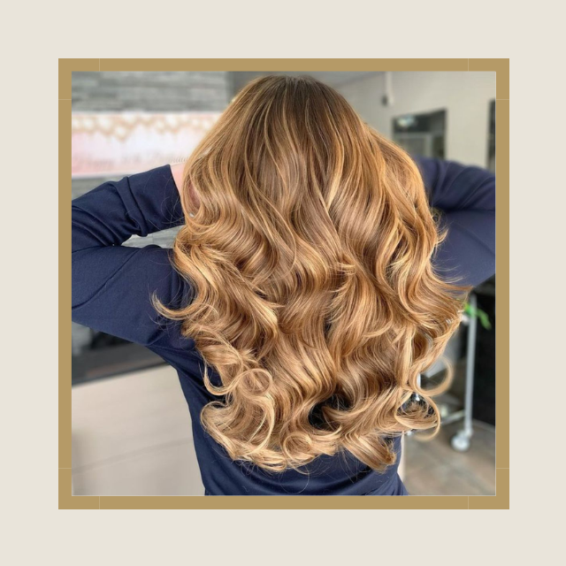Back of girl's head showing hair with butterfly layers and bouncy blow-dry combination