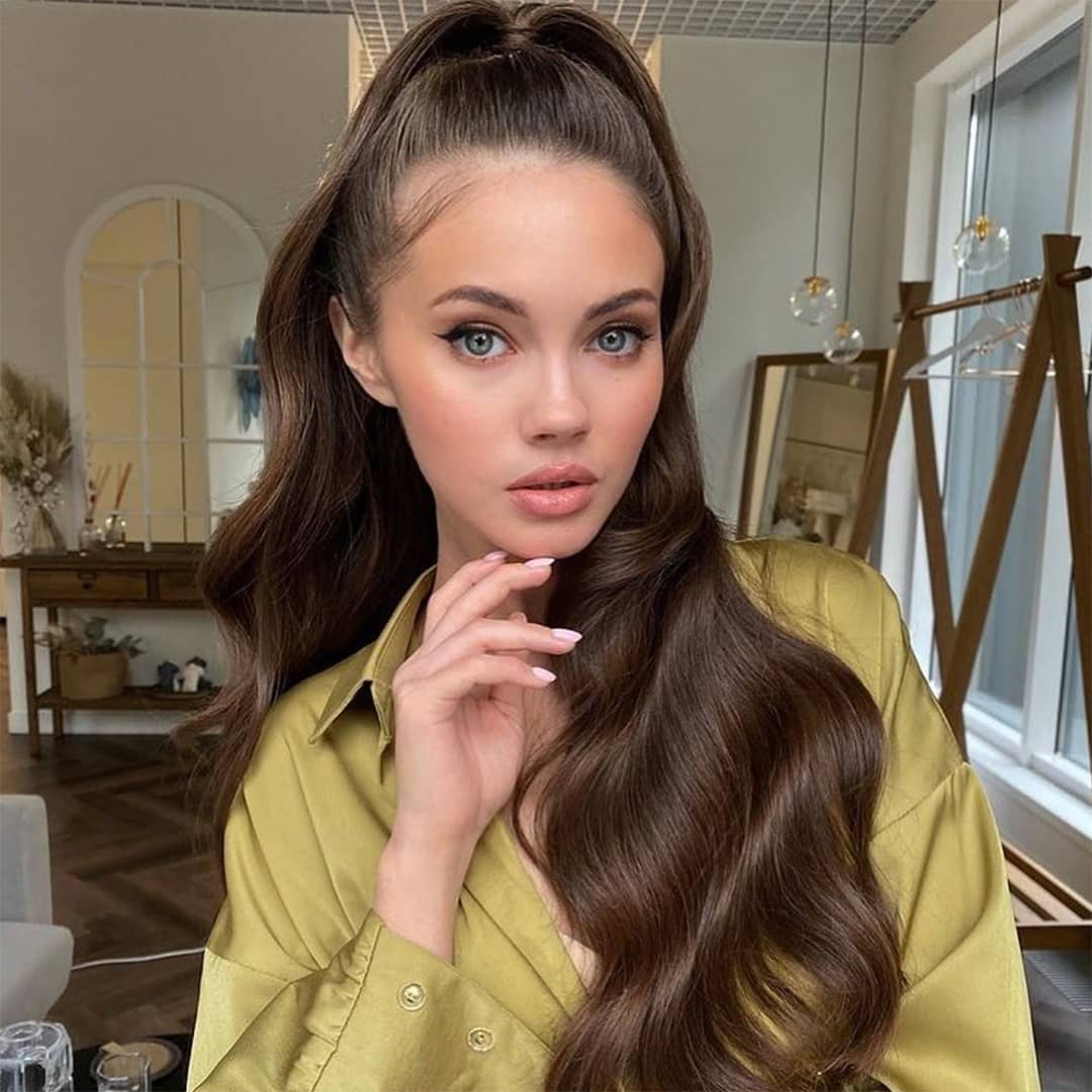Woman with brown clip in hair extensions without damage